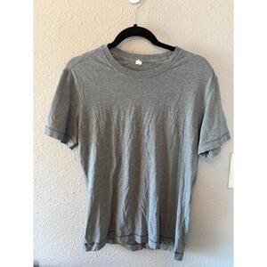 Men's Lululemon grey tshirt size M. GUC other than tiny pin hole on shoulder